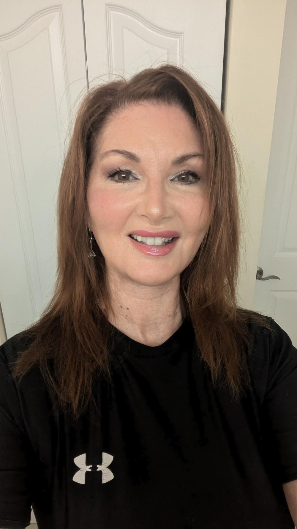 Tracy Mullane smiling in a black athletic T-shirt